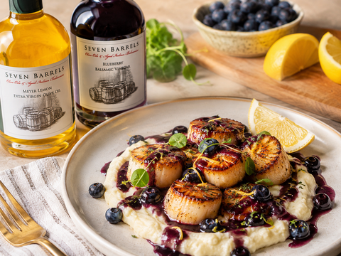 Seared scallops with blueberry Meyer lemon pan sauce, cauliflower purée, and Seven Barrels bottles