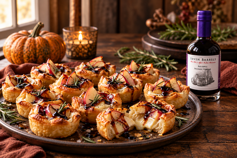 Apple and brie puff pastry bites drizzled with Seven Barrels Red Apple Balsamic Vinegar
