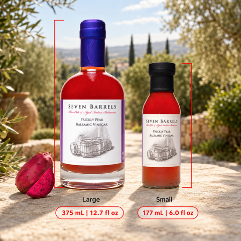 Two bottles of Seven Barrels Picky Pear Balsamic Vinegar shown outdoors on a stone surface, with a large bottle labeled Large and a smaller bottle labeled Small. Red measurement lines and text indicate the sizes and volumes.